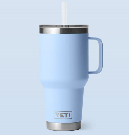Blue YETI mug with a straw on a light blue background 35-oz-