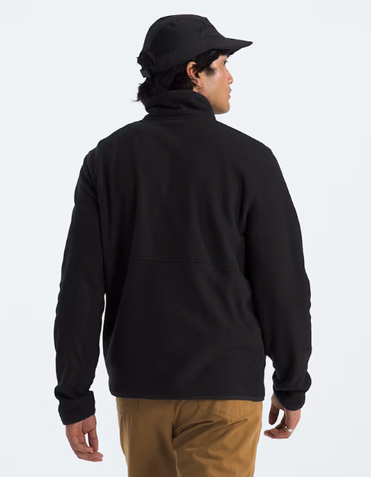 black fleece jacket with a hood, North face logo on the chest and a cap on his head.