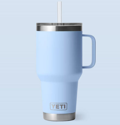 Blue YETI mug with a straw on a light blue background  35-oz-
