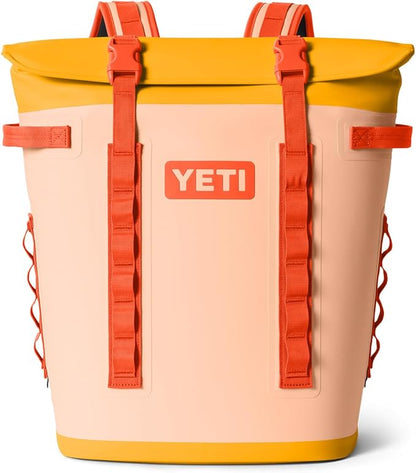 YETI backpack with orange straps and yellow Hopper M Series Backpack Soft Sided Coolers with MagShield Access
