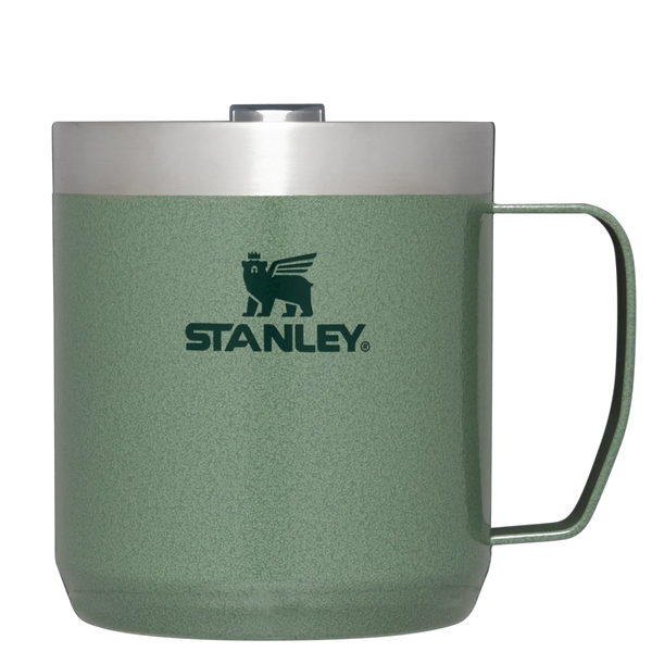 A green Stanley camp mug with a Tritan lid, featuring the Stanley logo on the front.