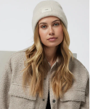  beige knit beanie and light brown jacket Vuori Label Beanie